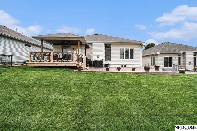 7409 N 160th St, Bennington, NE 68007 - rear view of property featuring a patio area, a lawn, and a deck
