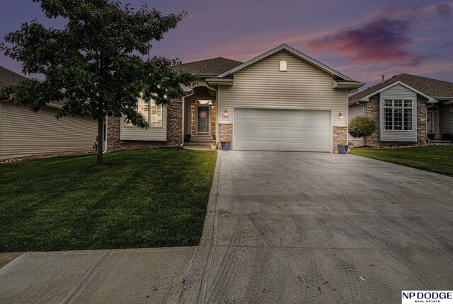 7409 N 160th St, Bennington, NE 68007 - ranch-style house with stone siding, driveway, a garage, and a lawn