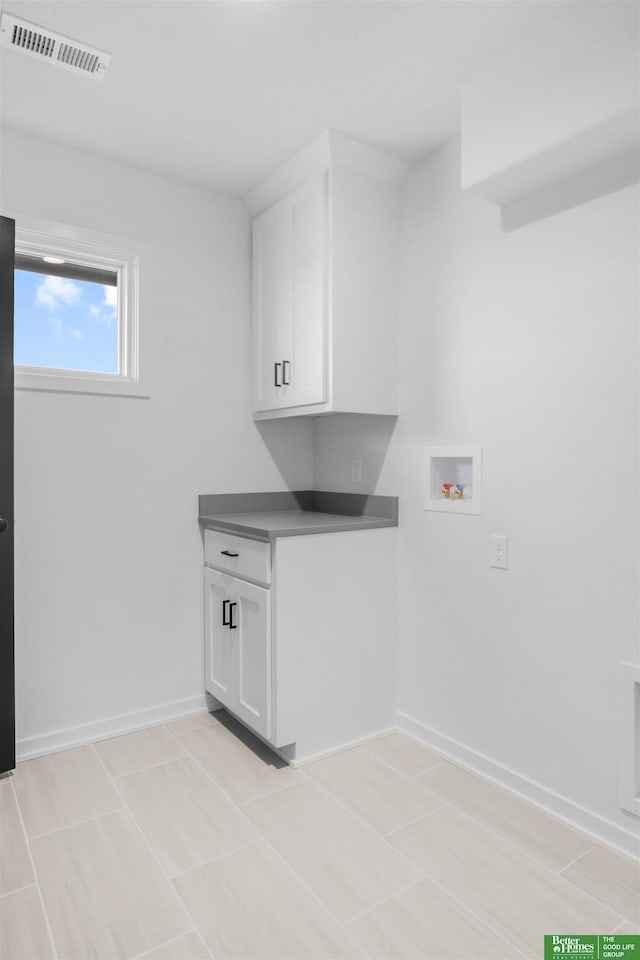5409 N 196th Ave, Elkhorn, NE 68022 - laundry room with hookup for a washing machine, cabinet space, and baseboards