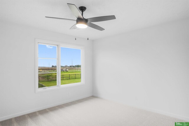 5409 N 196th Ave, Elkhorn, NE 68022 - empty room featuring light colored carpet, baseboards, and a ceiling fan