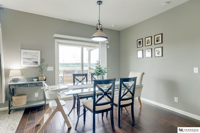 2206 Alexandra Rd, Papillion, NE 68133 - dining area featuring baseboards and dark wood finished floors