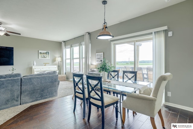 2206 Alexandra Rd, Papillion, NE 68133 - dining room with ceiling fan, dark wood-type flooring, and baseboards