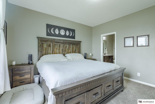 2206 Alexandra Rd, Papillion, NE 68133 - bedroom with light colored carpet, baseboards, and ensuite bath