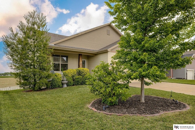 2206 Alexandra Rd, Papillion, NE 68133 - view of front facade featuring concrete driveway, a front lawn, a garage, and a shingled roof