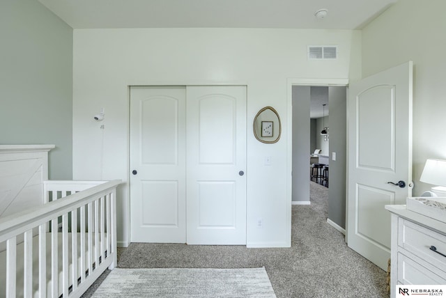 2206 Alexandra Rd, Papillion, NE 68133 - bedroom with light carpet, a closet, baseboards, and a nursery area