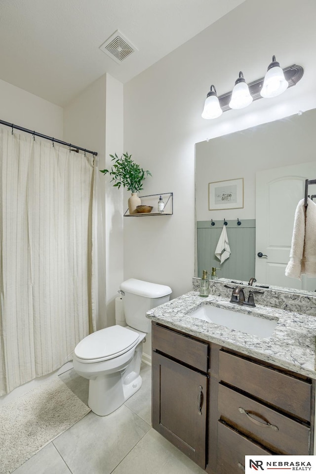 2206 Alexandra Rd, Papillion, NE 68133 - full bath with vanity, toilet, tile patterned floors, and a shower with shower curtain