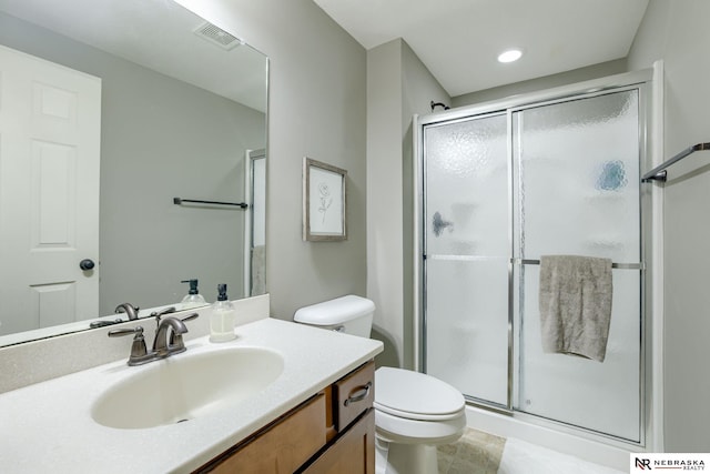 2206 Alexandra Rd, Papillion, NE 68133 - bathroom with toilet, a shower stall, vanity, and recessed lighting