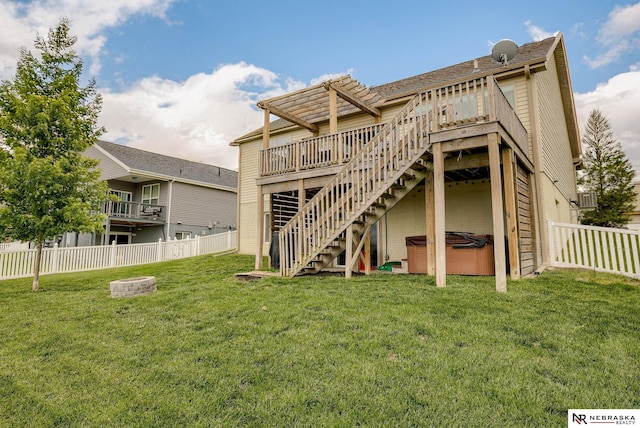 2206 Alexandra Rd, Papillion, NE 68133 - rear view of house featuring a hot tub, stairs, a wooden deck, a pergola, and an outdoor fire pit