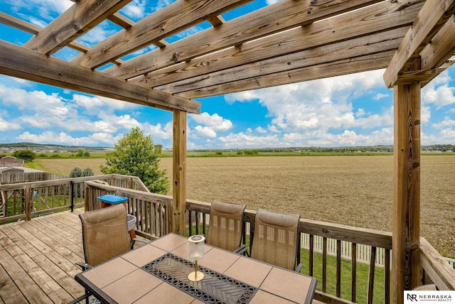2206 Alexandra Rd, Papillion, NE 68133 - deck featuring a view of countryside, outdoor dining area, a pergola, and agricultural plots