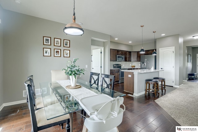 2206 Alexandra Rd, Papillion, NE 68133 - dining area featuring recessed lighting, baseboards, and dark wood finished floors