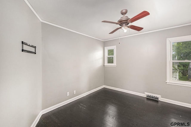 3519 N 53rd St, Omaha, NE 68104 - unfurnished room featuring baseboards, ornamental molding, a ceiling fan, and dark wood-style floors