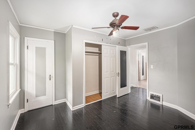 3519 N 53rd St, Omaha, NE 68104 - unfurnished bedroom featuring wood finished floors, baseboards, crown molding, a closet, and a ceiling fan