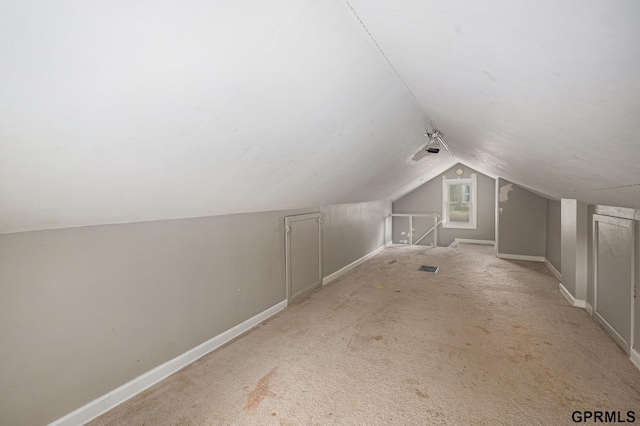 3519 N 53rd St, Omaha, NE 68104 - additional living space with baseboards, vaulted ceiling, and carpet flooring