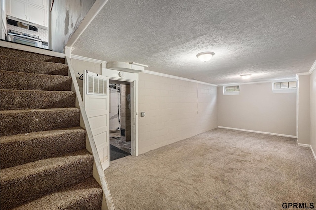 3519 N 53rd St, Omaha, NE 68104 - below grade area featuring carpet flooring, stairs, and a textured ceiling
