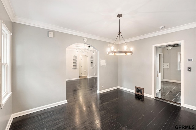 3519 N 53rd St, Omaha, NE 68104 - empty room featuring arched walkways, dark wood finished floors, baseboards, a chandelier, and ornamental molding