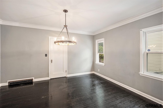 3519 N 53rd St, Omaha, NE 68104 - empty room featuring a chandelier, crown molding, baseboards, and dark wood-style flooring
