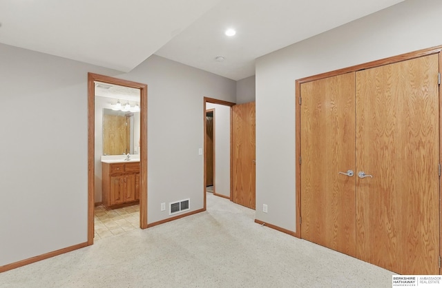 17616 Englewood St, Omaha, NE 68135 - unfurnished bedroom with baseboards, a closet, light carpet, a sink, and recessed lighting