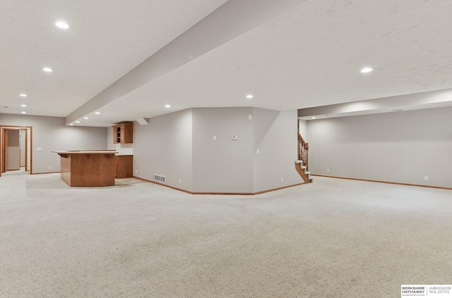17616 Englewood St, Omaha, NE 68135 - finished basement with baseboards, stairway, bar, and recessed lighting