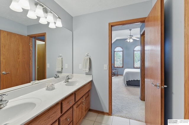 17616 Englewood St, Omaha, NE 68135 - ensuite bathroom featuring double vanity, tile patterned flooring, ceiling fan, and baseboards