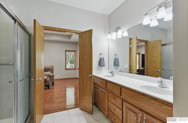 17616 Englewood St, Omaha, NE 68135 - full bathroom with double vanity, tile patterned flooring, and a stall shower