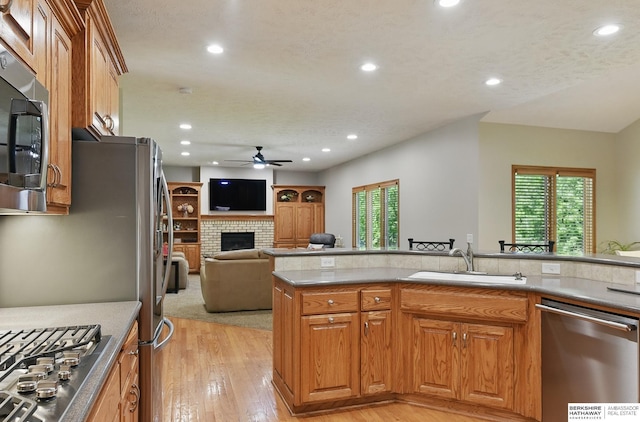 17616 Englewood St, Omaha, NE 68135 - kitchen with appliances with stainless steel finishes, a sink, a ceiling fan, recessed lighting, and light wood finished floors