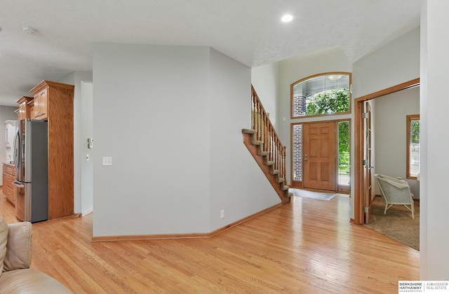 17616 Englewood St, Omaha, NE 68135 - foyer entrance featuring light wood-style flooring, stairway, baseboards, and recessed lighting