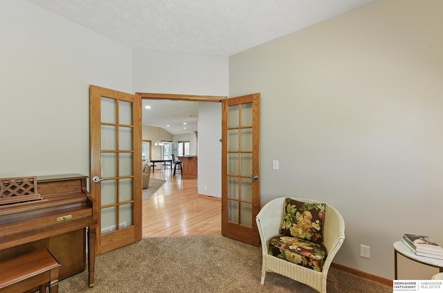17616 Englewood St, Omaha, NE 68135 - living area featuring french doors, carpet, baseboards, and recessed lighting