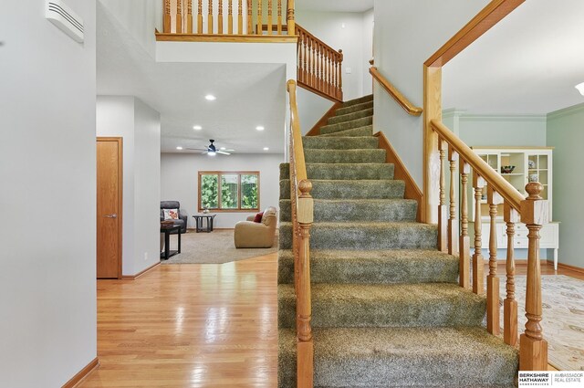 17616 Englewood St, Omaha, NE 68135 - staircase with wood finished floors, baseboards, ceiling fan, and recessed lighting