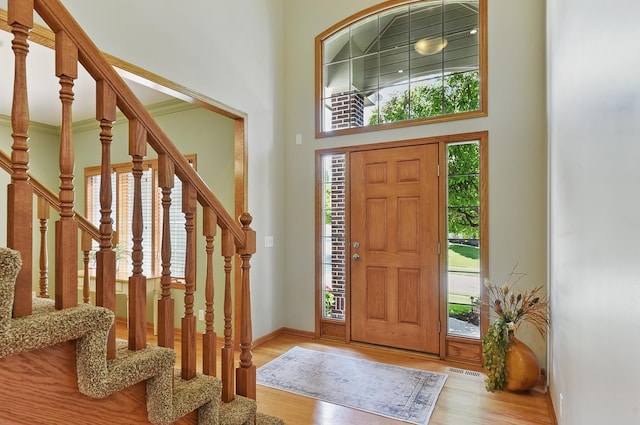 17616 Englewood St, Omaha, NE 68135 - foyer with stairs, wood finished floors, baseboards, and a high ceiling
