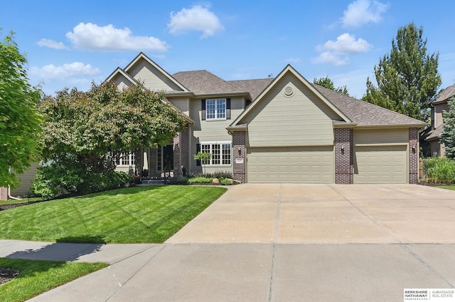 17616 Englewood St, Omaha, NE 68135 - view of front facade with brick siding, concrete driveway, an attached garage, and a front lawn