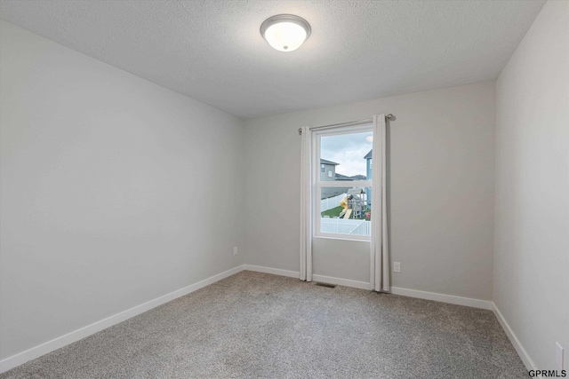 17312 Potter St, Bennington, NE 68005 - empty room with light carpet, a textured ceiling, and baseboards