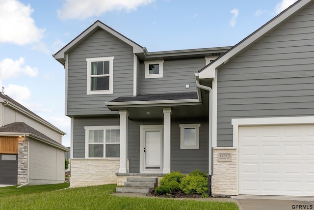 17312 Potter St, Bennington, NE 68005 - view of front of house with stone siding and a garage
