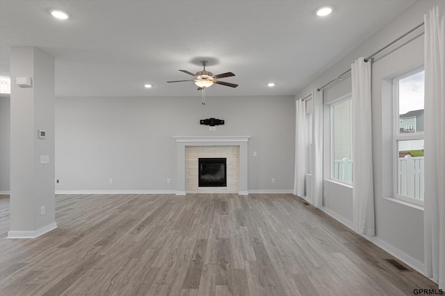 17312 Potter St, Bennington, NE 68005 - unfurnished living room featuring ceiling fan, light wood finished floors, a fireplace, baseboards, and recessed lighting
