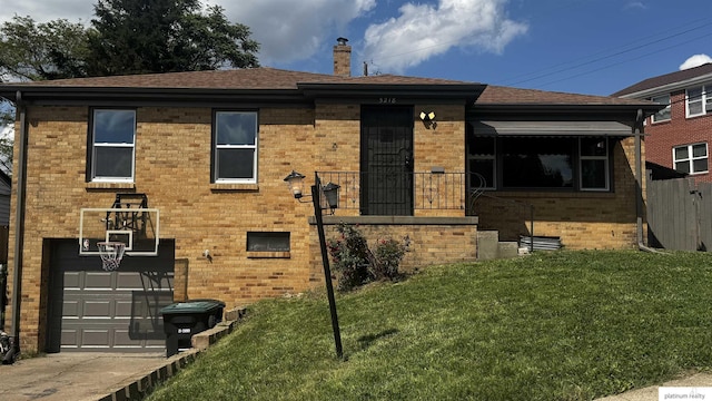 5218 Boyd St, Omaha, NE 68104 - view of front of property featuring an attached garage, brick siding, a chimney, and a shingled roof