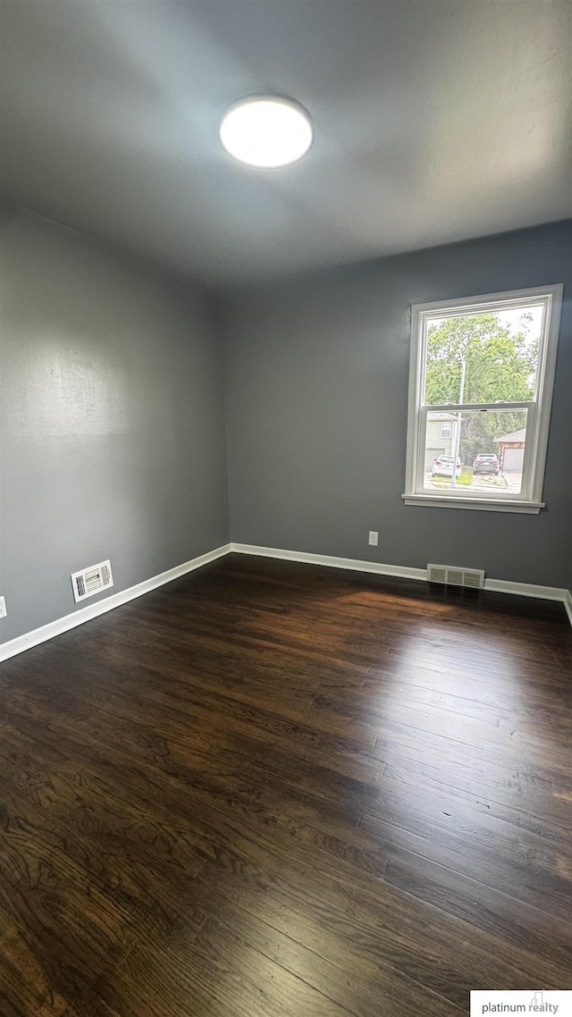 5218 Boyd St, Omaha, NE 68104 - unfurnished room featuring dark wood-type flooring and baseboards