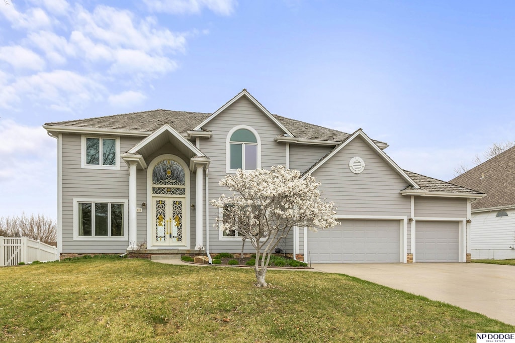 12828 Eagle Run Dr, Omaha, NE 68164 - traditional-style home with concrete driveway and an attached garage