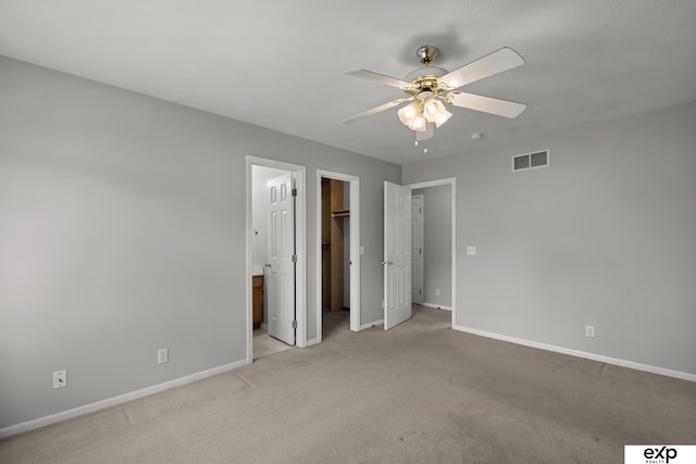 3003 Sheridan Rd, Bellevue, NE 68123 - unfurnished bedroom featuring baseboards, light colored carpet, and a spacious closet