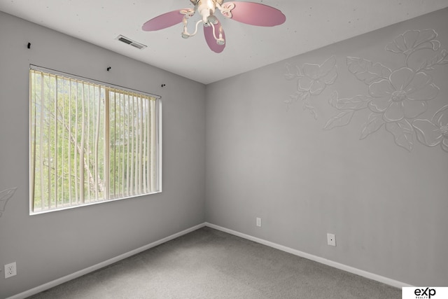 3003 Sheridan Rd, Bellevue, NE 68123 - spare room featuring a ceiling fan, plenty of natural light, baseboards, and carpet