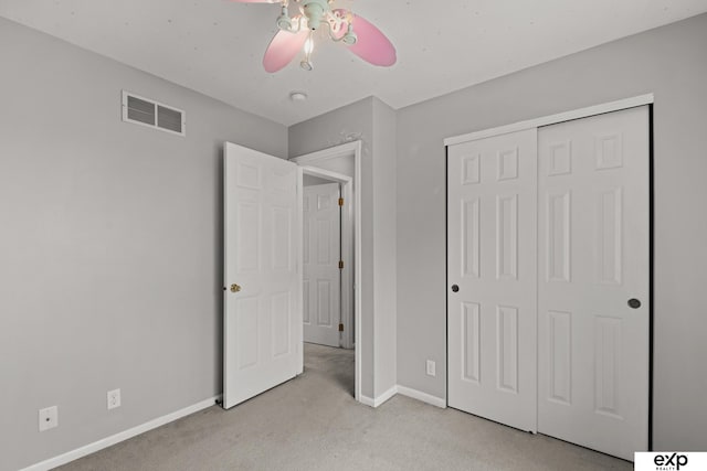 3003 Sheridan Rd, Bellevue, NE 68123 - unfurnished bedroom with carpet, baseboards, a closet, and a ceiling fan