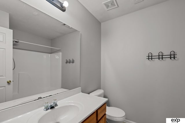 3003 Sheridan Rd, Bellevue, NE 68123 - full bathroom featuring toilet, vanity, a shower, and baseboards