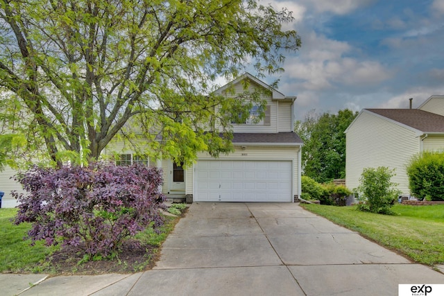 3003 Sheridan Rd, Bellevue, NE 68123 - view of front of house with a garage, driveway, and a front lawn