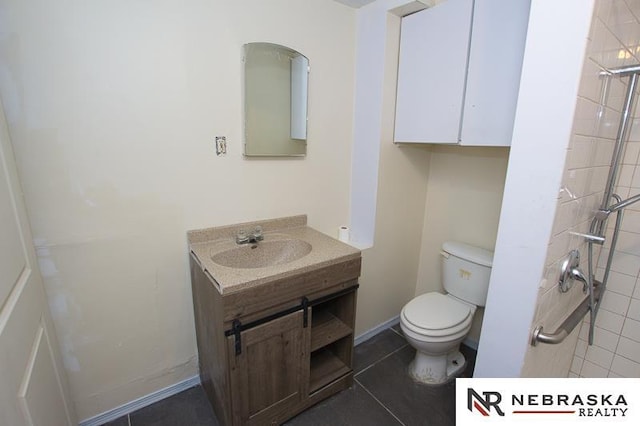 1801 Euclid Ave, Lincoln, NE 68502 - bathroom featuring toilet, vanity, and a tile shower