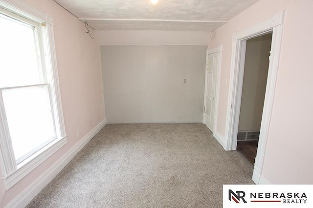 1801 Euclid Ave, Lincoln, NE 68502 - carpeted spare room with plenty of natural light