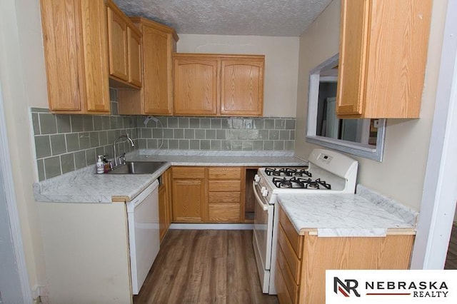 1801 Euclid Ave, Lincoln, NE 68502 - kitchen with white appliances, a sink, dark wood-style floors, light countertops, and a textured ceiling