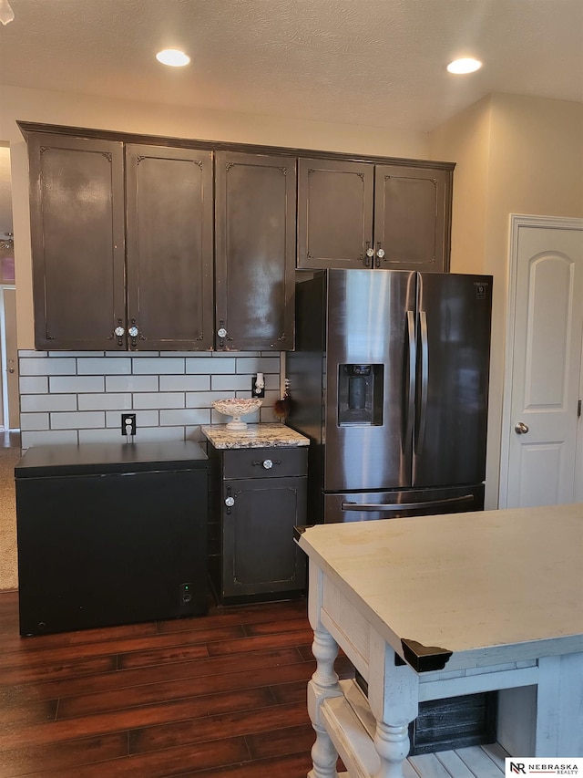 16228 Virginia St, Omaha, NE 68136 - kitchen featuring stainless steel refrigerator with ice dispenser, dark wood-type flooring, fridge, recessed lighting, and light countertops