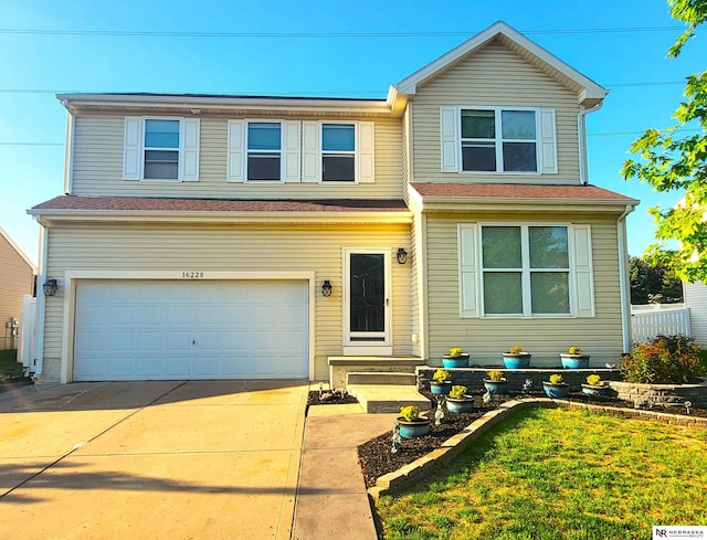 16228 Virginia St, Omaha, NE 68136 - traditional-style home with an attached garage and concrete driveway