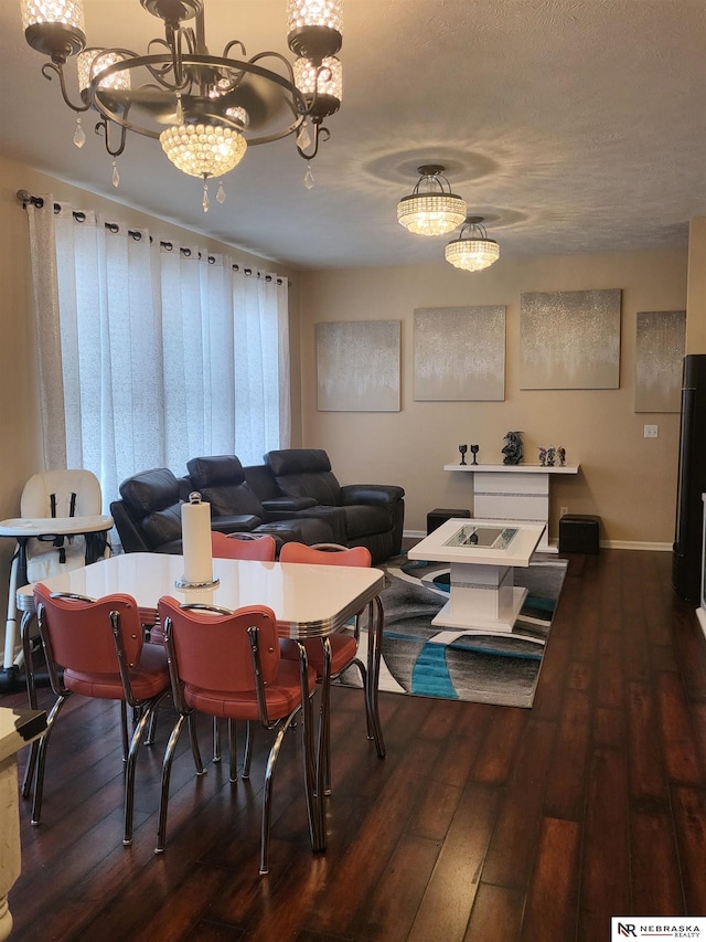 16228 Virginia St, Omaha, NE 68136 - dining space with hardwood / wood-style flooring, a chandelier, and baseboards