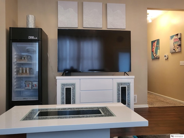 16228 Virginia St, Omaha, NE 68136 - kitchen featuring wood finished floors, baseboards, glass insert cabinets, and light countertops