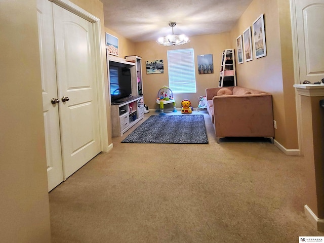 16228 Virginia St, Omaha, NE 68136 - carpeted living area with a chandelier and baseboards
