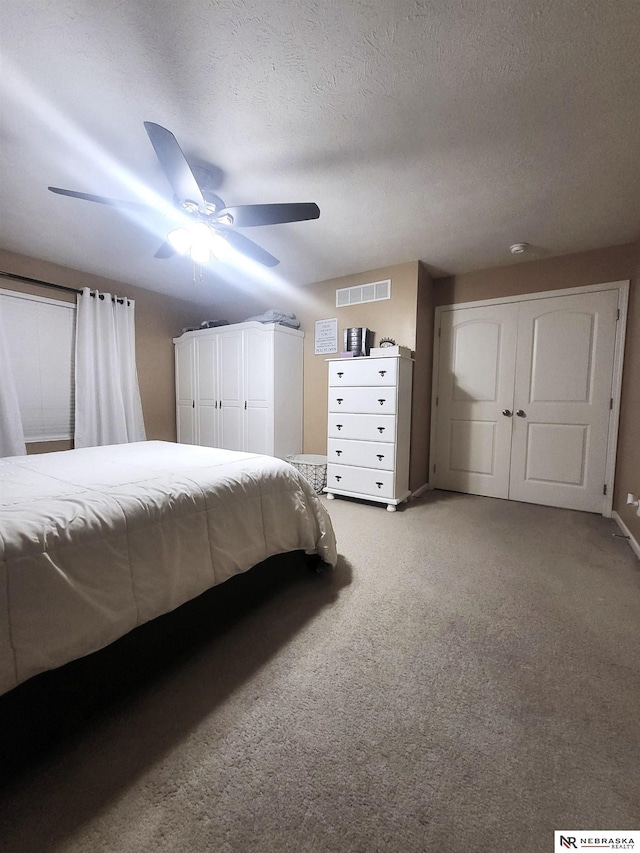 16228 Virginia St, Omaha, NE 68136 - bedroom featuring light carpet, ceiling fan, and a textured ceiling